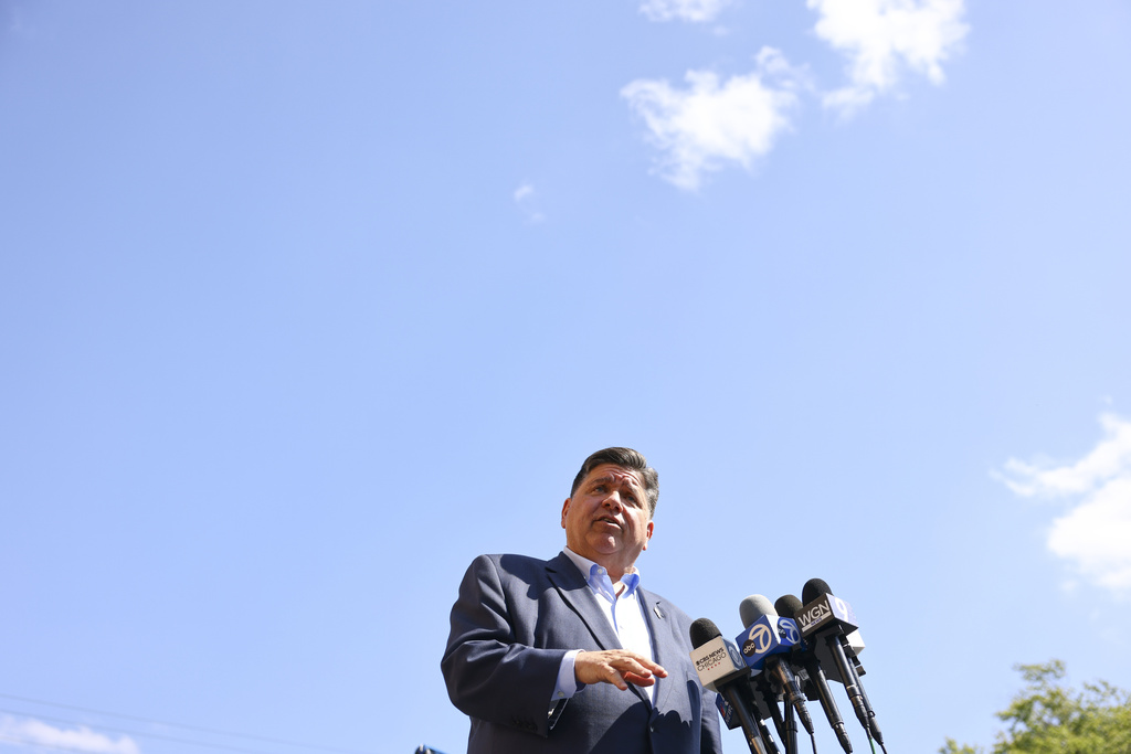 Gov. JB Pritzker speaks with reporters after visiting Prairie Oak Elementary School in Berwyn, Ill.