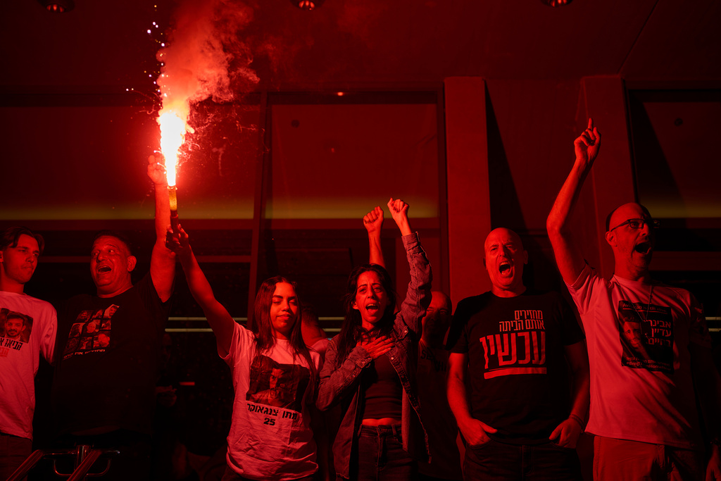 Einav Zangauker, center, mother of Matan Zangauker, who is being held hostage by Hamas, celebrates along with other families and supporters of Israeli hostages after the announcement that Israel and Hamas have agreed to the first phase of a peace plan