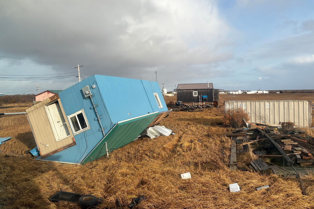 Home rests on its roof after being knocked over in Kotlik, Alaska, after the remnants of Typhoon Halong hit western Alaska