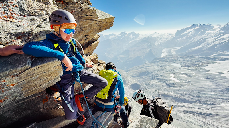 Samuel Adventure Evermore takes in the mountain scape with a bird