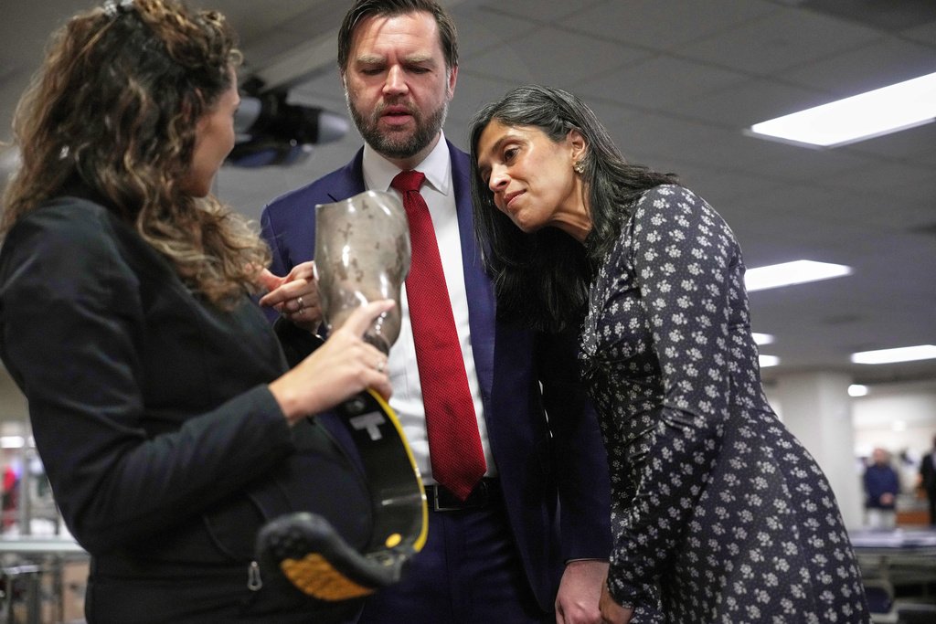 Jamie Boehm, left, Chief of Prosthetic and Orthotic Services at Walter Reed National Military Medical Center, discusses prosthetics with Vice President JD Vance and second lady Usha Vance as they tour the Military Advanced Training Center (MATC) at Walter Reed National Military Medical Center