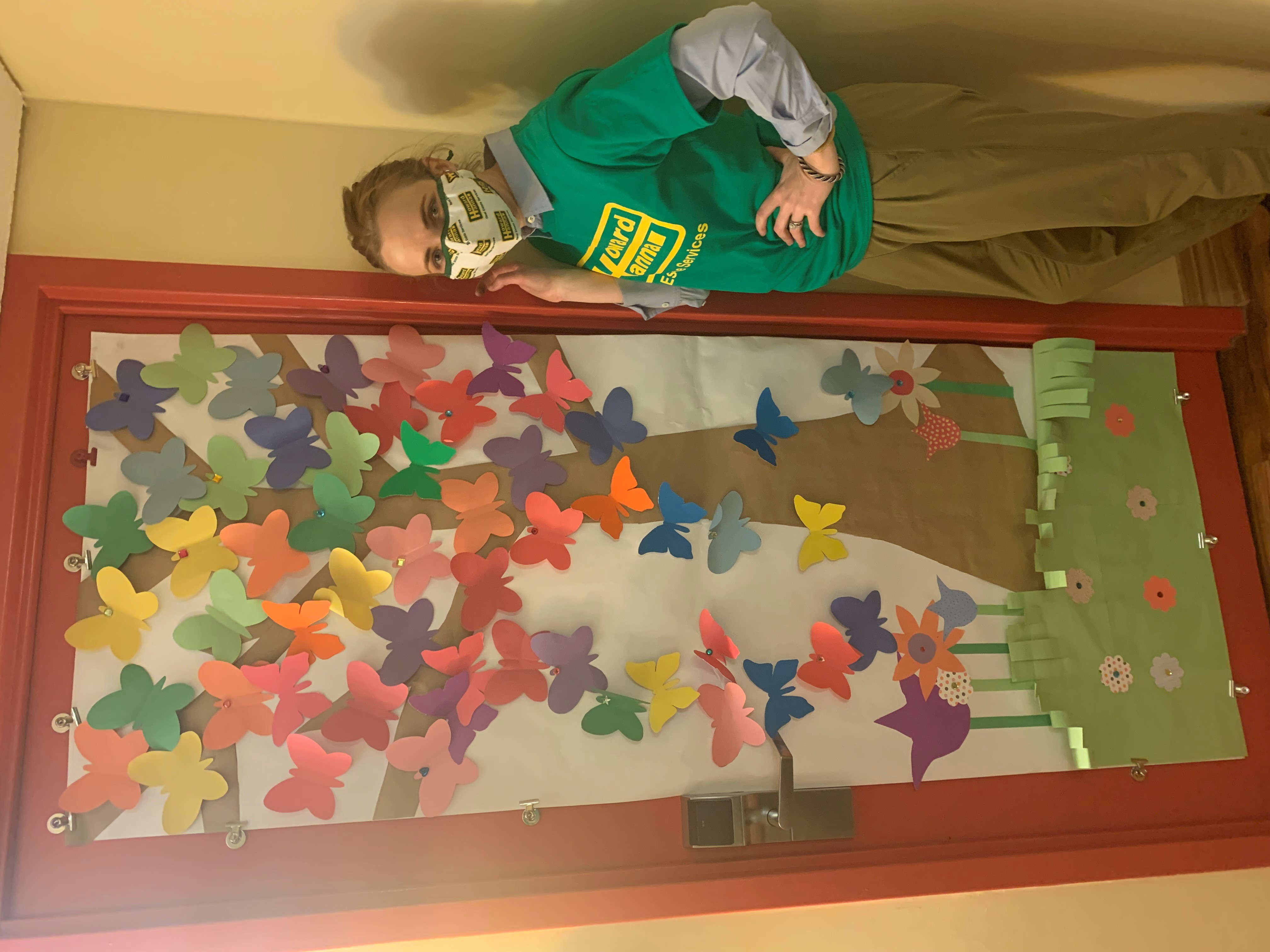 Danielle Shearer poses with a homemade door decoration for Ronald McDonald House Charities in Pittsburgh