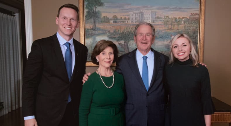 Man standing next to former president George W Bush, Barbara Bush and Richard