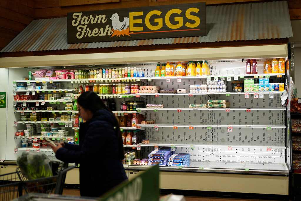 A shopper buys groceries in Nashville, Tenn., ahead of a winter storm 