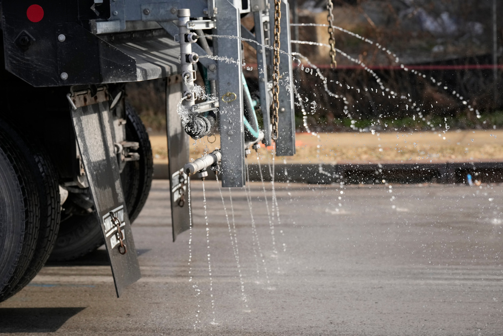 A Nashville Department of Transportation truck applies salt brine to a roadway 