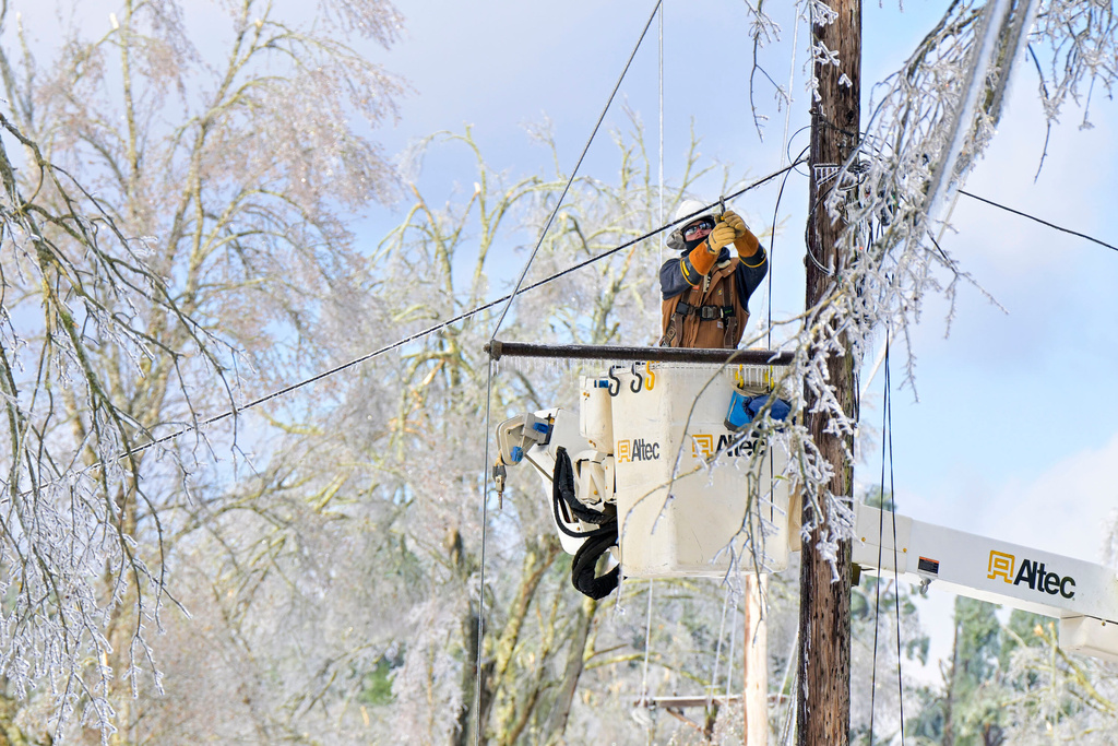 Lineman works to restore power in Oxford, Miss.