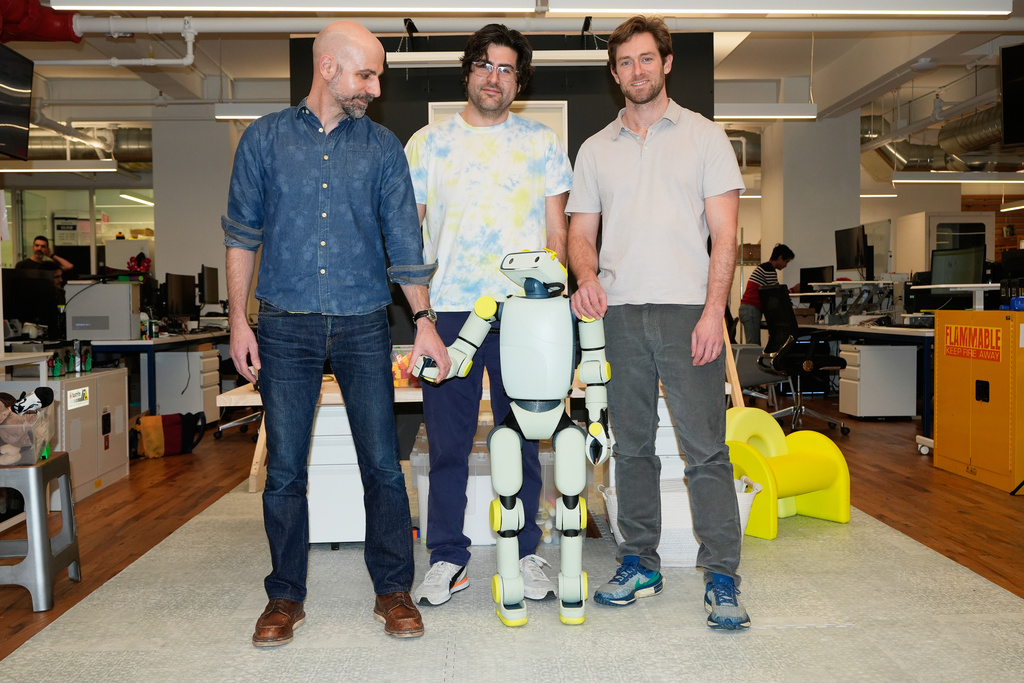 Fauna Robotics VP of hardware Anthony Moshchella, left, and co-founders Josh Merel, center, and Rob Cochran, with Sprout, the company