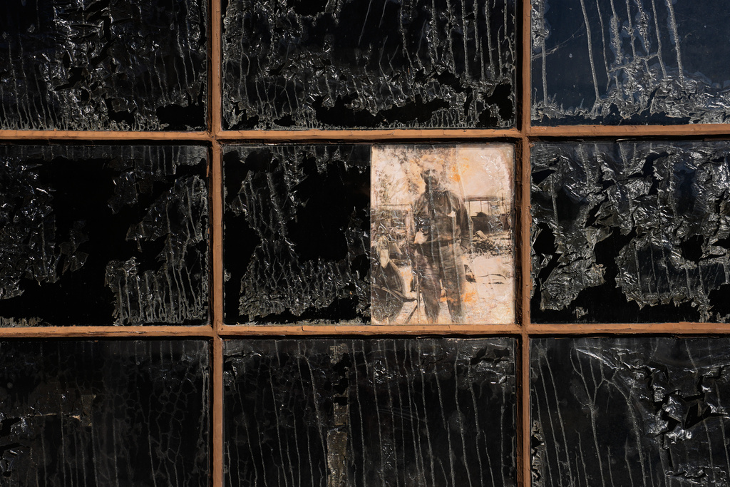 A picture of Albert Johnson is on display in a window at Scotty