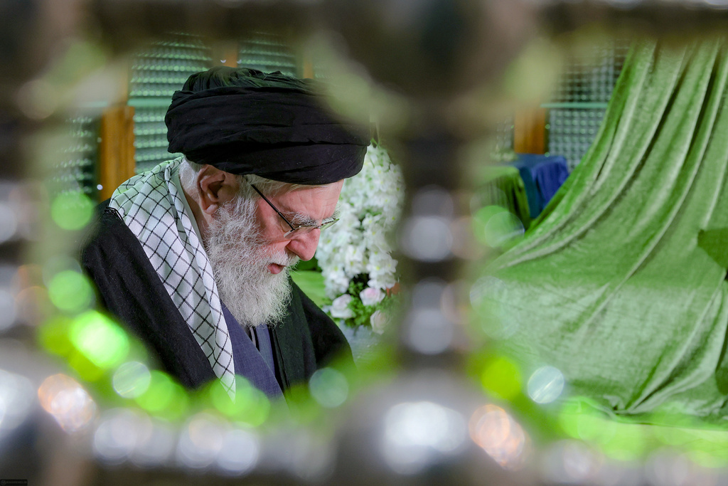 Supreme Leader Ayatollah Ali Khamenei prays at the grave of the late revolutionary founder Ayatollah Khomeini