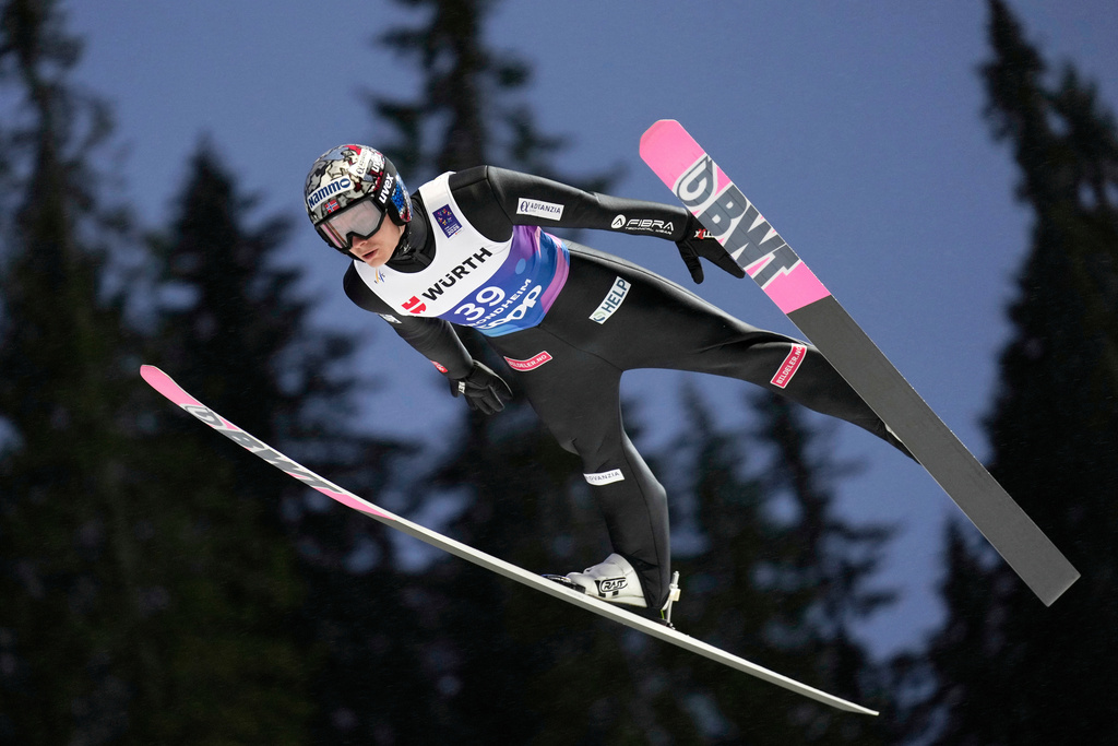Marius Lindvik, of Norway, soars through the air during his first round jump of the ski jumping men