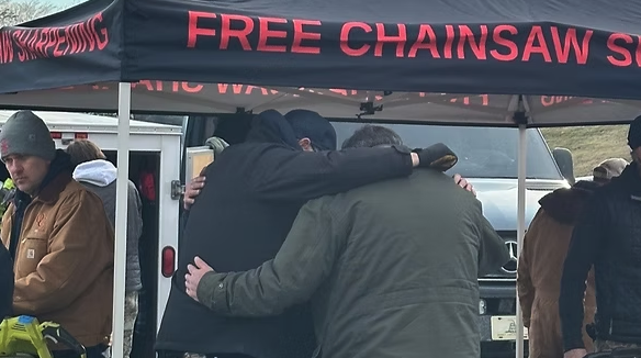 Men praying and huddled up