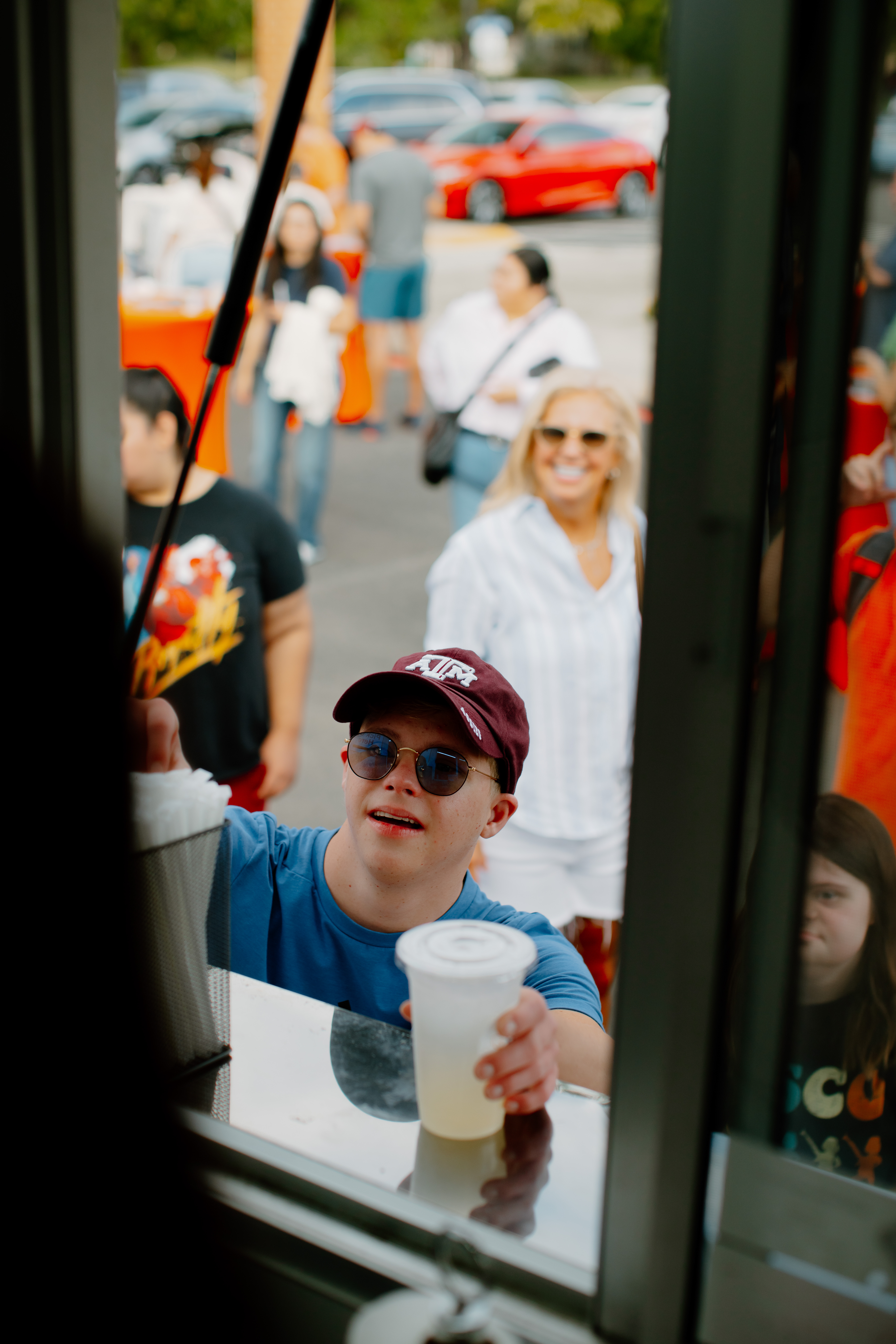 Lemonade Being Passed Out the Window To Excited Patrons From The Rising STARS Coffee Truck