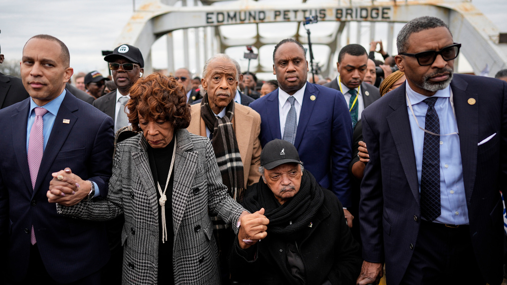 U.S. Rep. Hakeem Jeffries, D-NY, U.S. Rep. Maxine Waters, D-Calif., Rev. Al Sharpton, Rev. Jesse Jackson and NAACP President Derrick Johnson march across the Edmund Pettus bridge