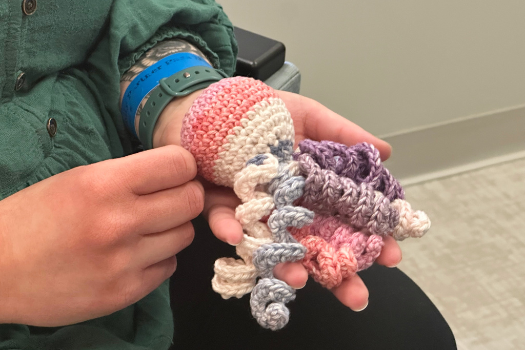 Joelle Haley holds amigurumi octopi 