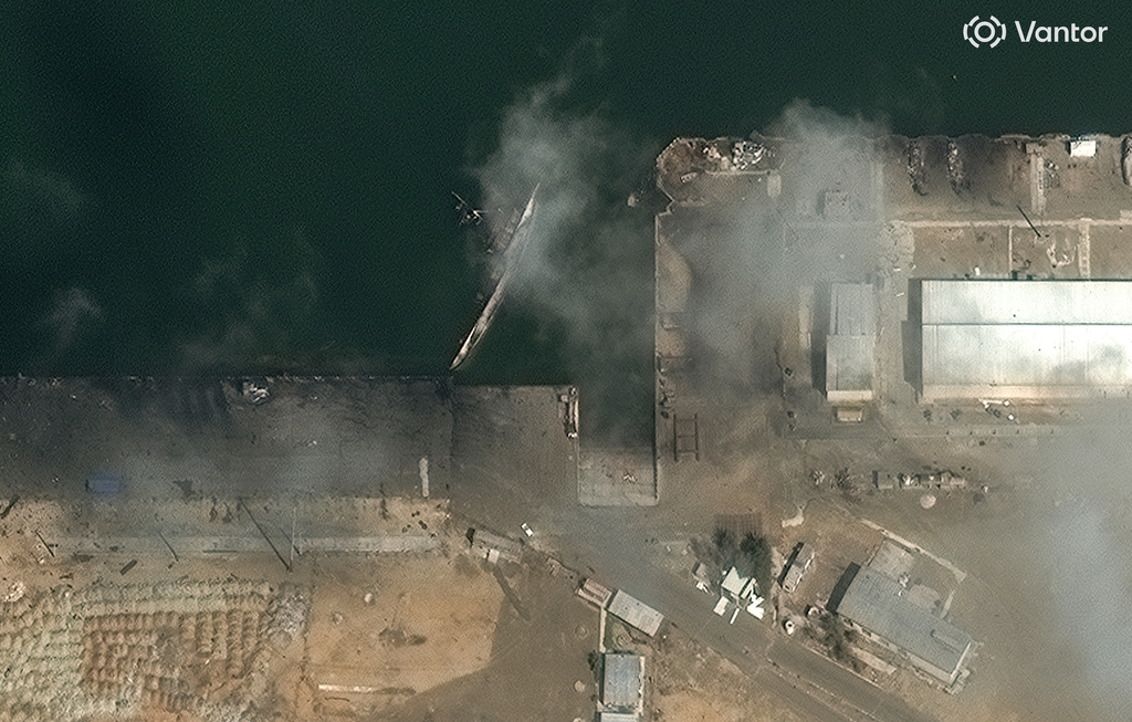 This satellite image provided by Vantor shows a view of capsized ship at Konarak Naval base in Iran 