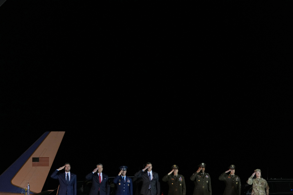 Vice President JD Vance, Defense Secretary Pete Hegseth, Chairman of the Joint Chiefs of Staff Gen. Dan Caine, and other military leaders, salute during a dignified transfer for Sgt. Benjamin N. Pennington, 26, of Glendale, Ky.