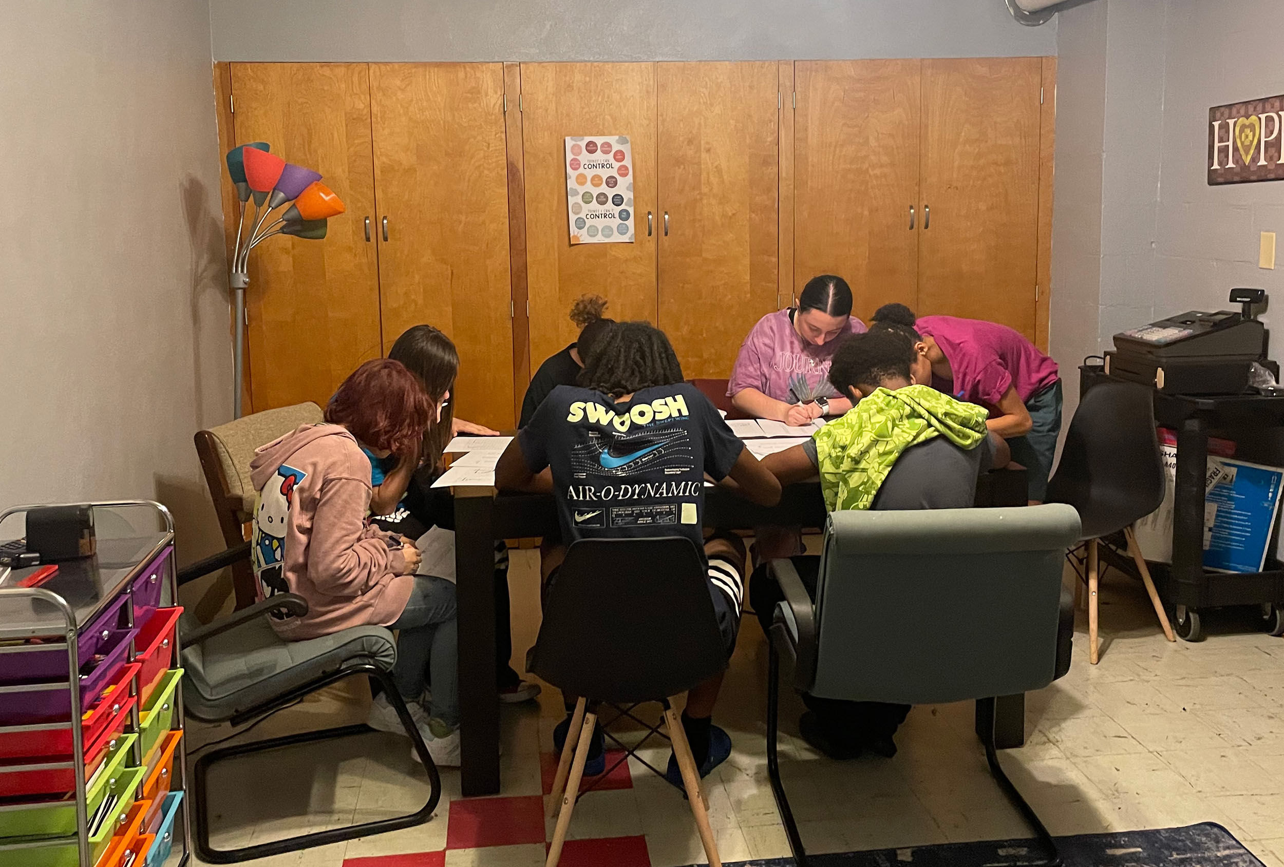Teenage students at the Rock of H.O.P.E. participate in academic activities and receive help with their homework