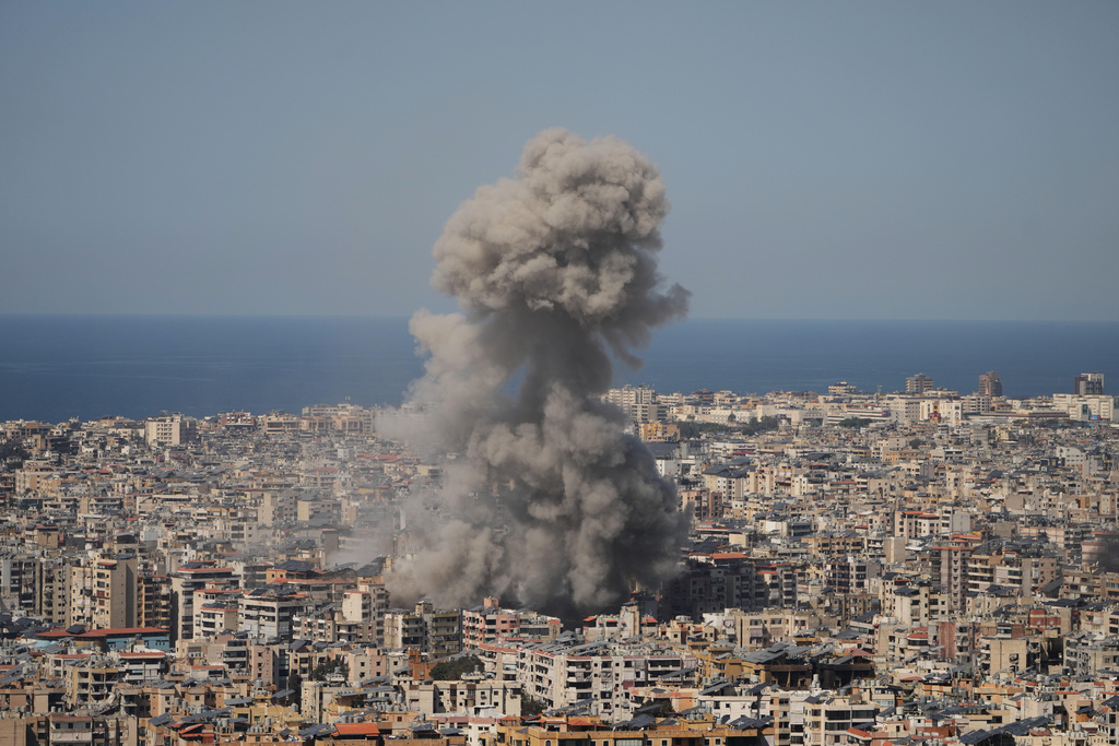Smoke rises from a building following an Israeli airstrike in Dahiyeh, Beirut