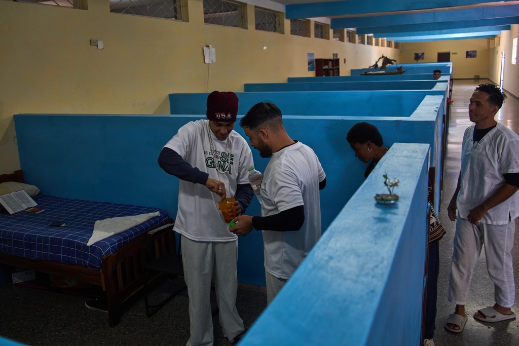 People in rehabilitation at a psychiatric hospital prepare a homemade cocoa cream candy to share