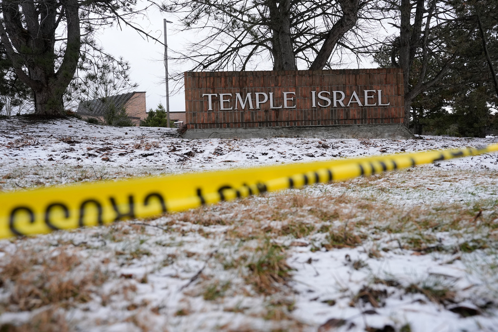 Police tape hangs outside the Temple Israel synagogue in West Bloomfield Township, Mich. 