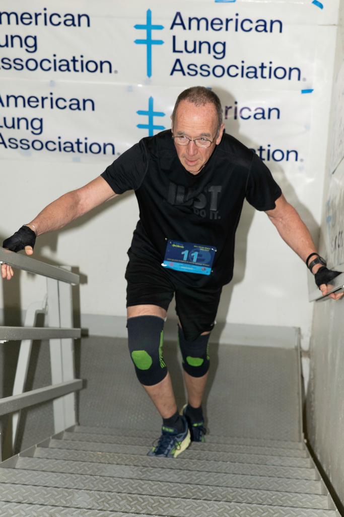 Tom McGee participates in a fundraising run in the Oakbrook Terrace Tower building in Oakbrook, Ill.