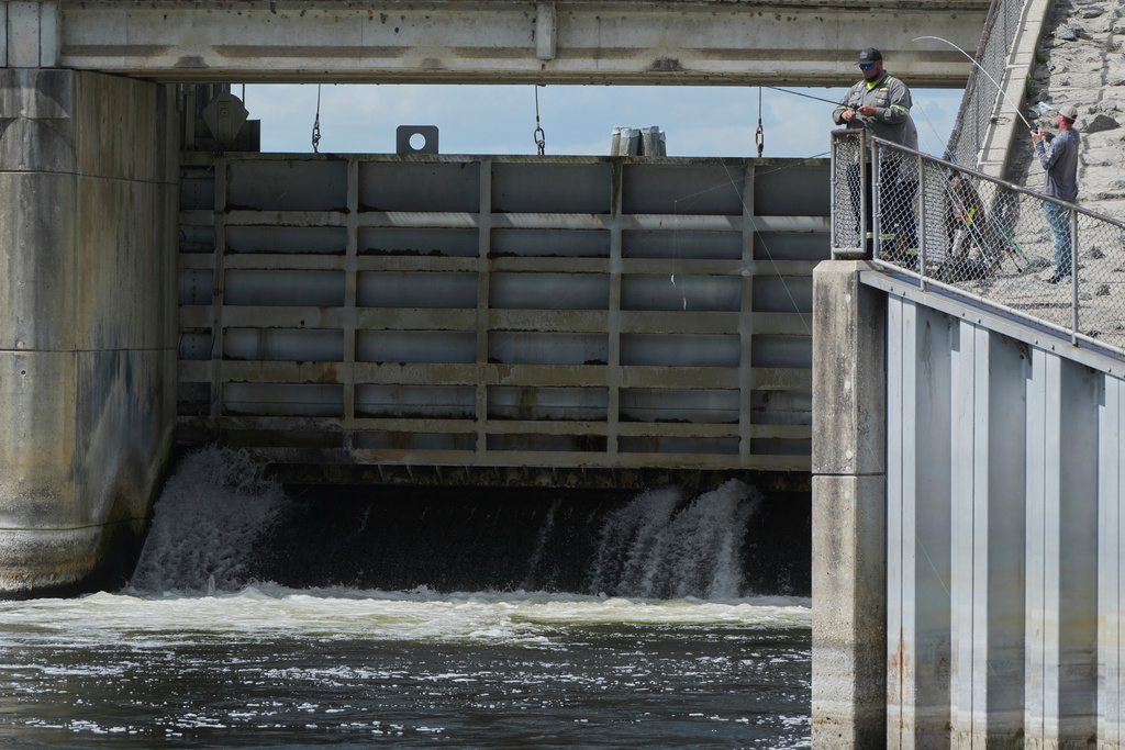 Fisherman throw their lines into the Kirkpatrick Dam spillway in Palatka, Fla. 