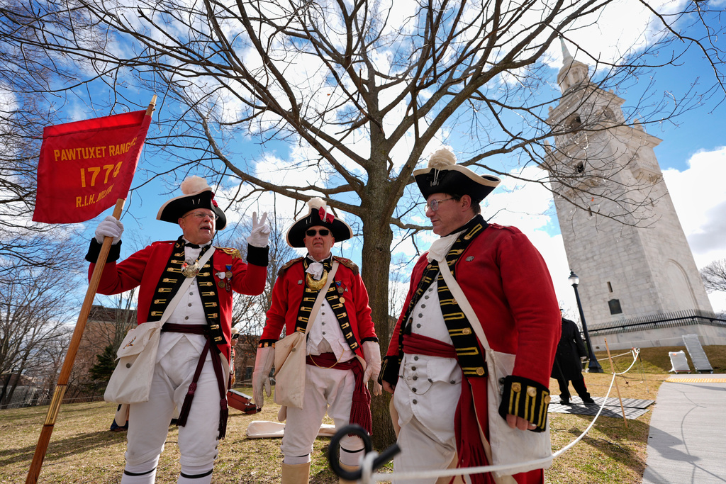 Pawtucket Rangers Militia reenactors assemble in an Evacuation Day ceremony marking the 1776 departure of British troops from the city