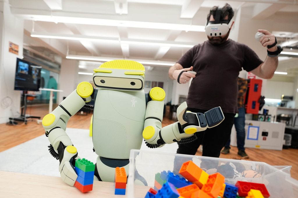 Kel Guerin, Fauna Robotics VP of platform architecture, demonstrates how to operate Sprout, Fauna Robotics