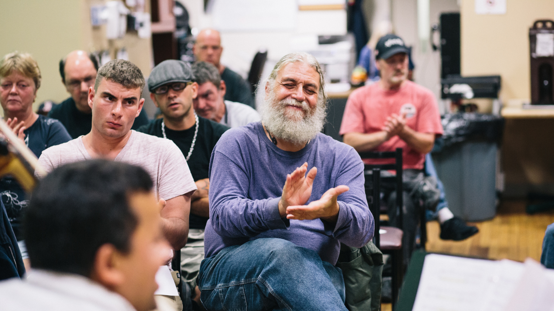 Audience members applaud at a Shelter Music Boston concert.