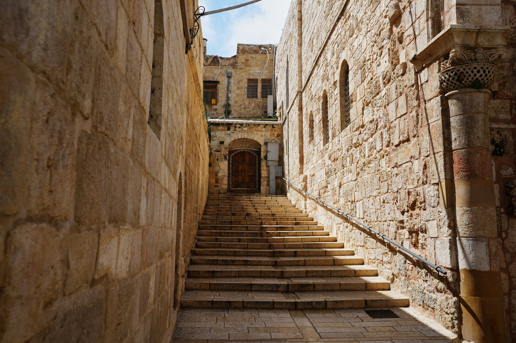 A locked door and empty stairs leading to the Church of the Holy Sepulchre in Jerusalem