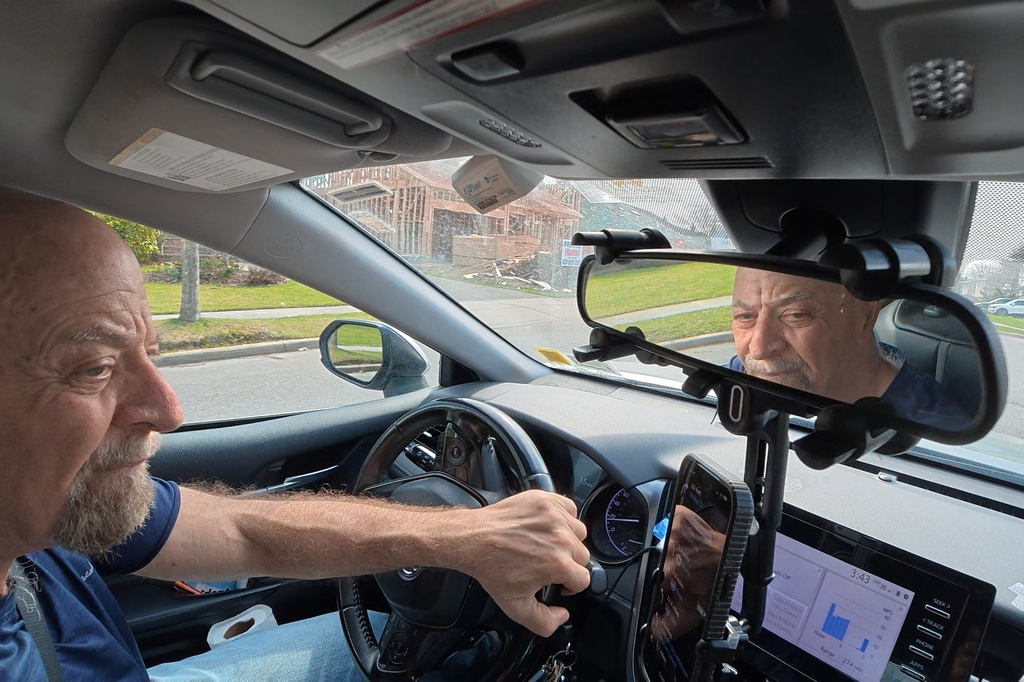 Retiree Stu Goldberg prepares to pick up passengers for Uber near Plainview, N.Y.