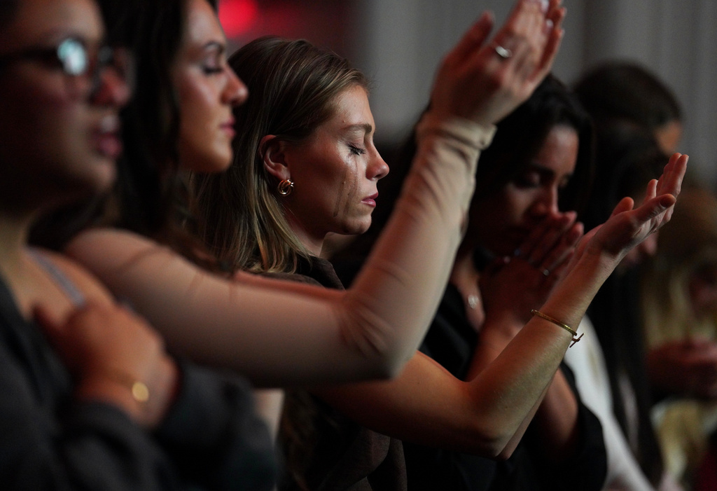 worship   Followers of the Christian podcast, "Girls Gone Bible," cry during the live show held at the Atlanta Symphony Hall