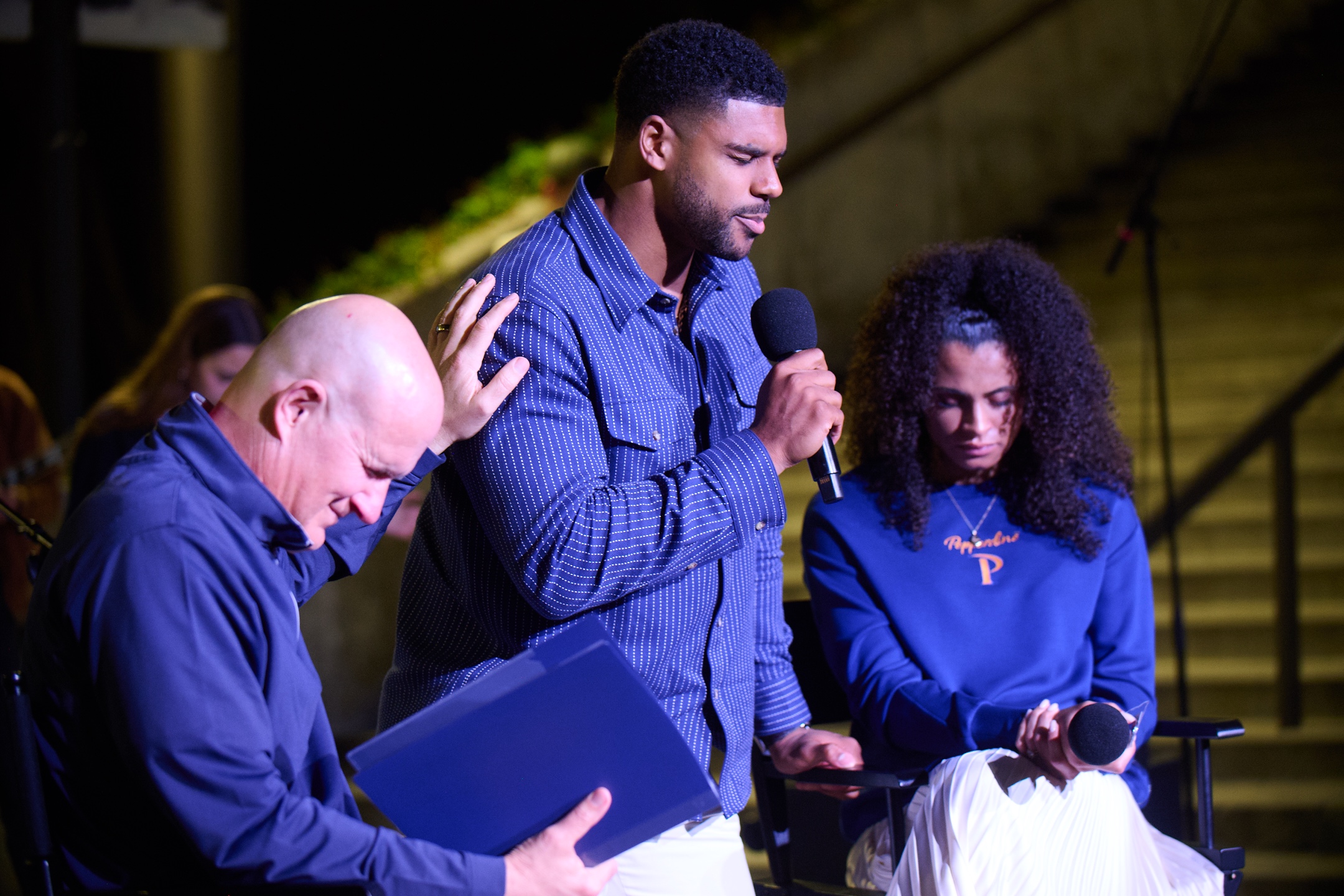 Sydney’s husband, former NFL player Andre Levrone Jr. leads prayer