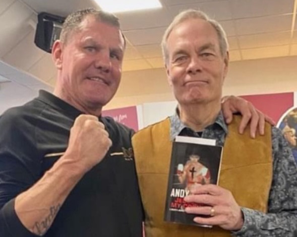 Andy Flute (left) advertising his book "Jesus In My Corner"