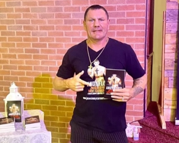 Andy Flute advertising his book "Jesus In My Corner"