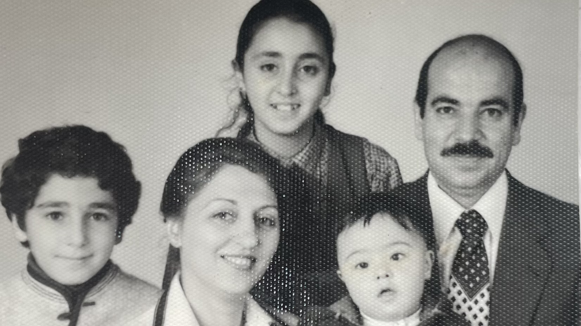David (left) and his family escaped Iran in 1979 under the guise of his mother receiving heart surgery.