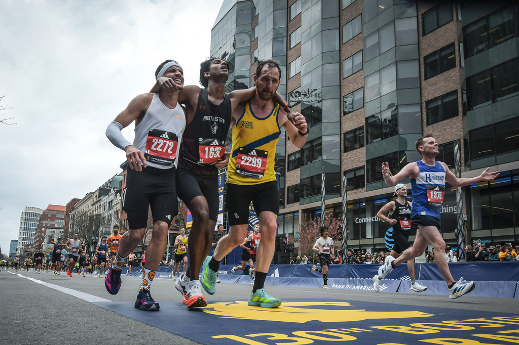 'Natural Instinct To Help' They Got An Exhausted Fellow Runner Across The Boston Marathon Finish Line 