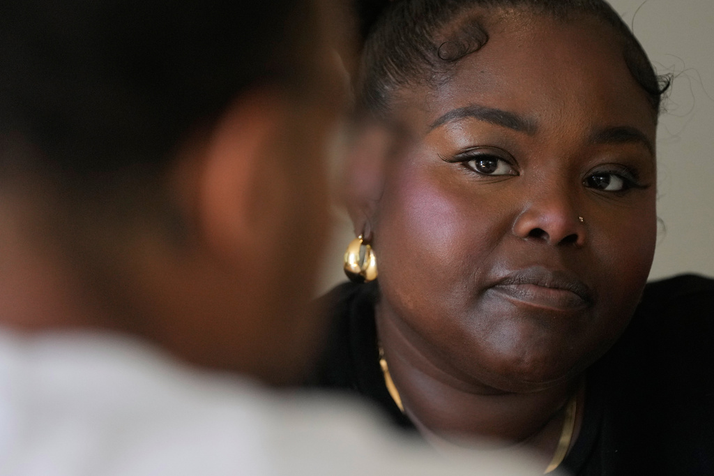 Oakland Ceasefire-Lifeline life coach LaSasha Long, right, talks to Bernard C. 