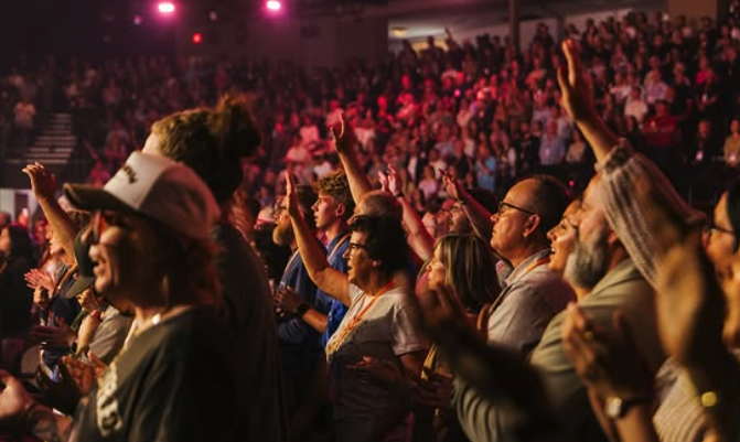 Thousands of people worshipping 