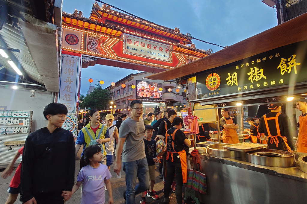 People visit the night market in Taipei, Taiwan