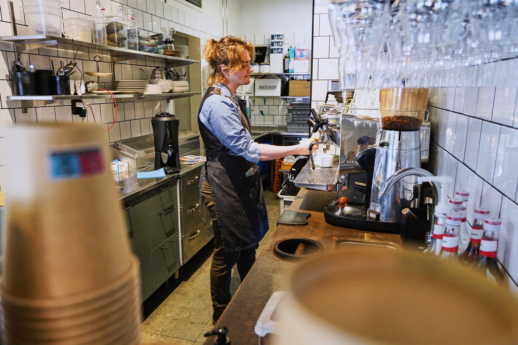 Barista Kajetan Grzelczak makes a coffee at Andon Café 