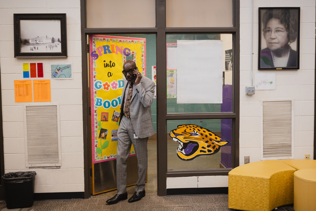 Birmingham City Schools Superintendent, Dr. Mark A. Sullivan, takes a call as he enters the library at Oxmoor Valley Elementary School in Birmingham, Ala.