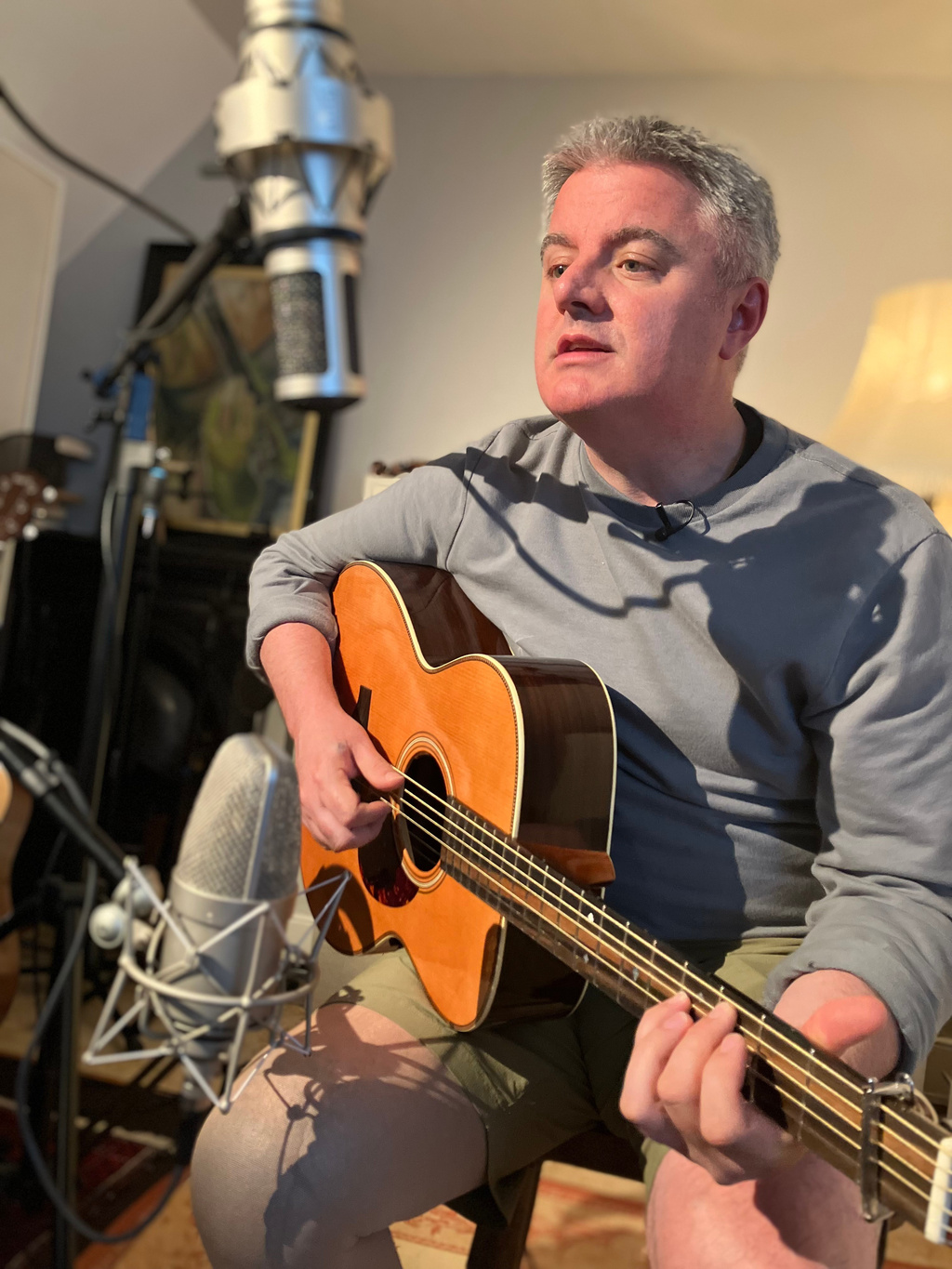Samuel Smith plays guitar in his home studio (2013)