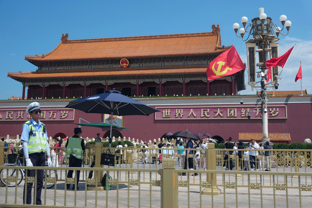 Flags bearing the hammer and sickle symbol are flown in front of Tiananmen Gate in Beijing