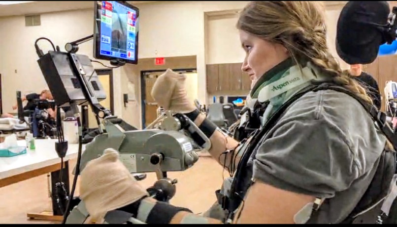 Madison doing therapy as she works to regain arm mobility following her car accident.