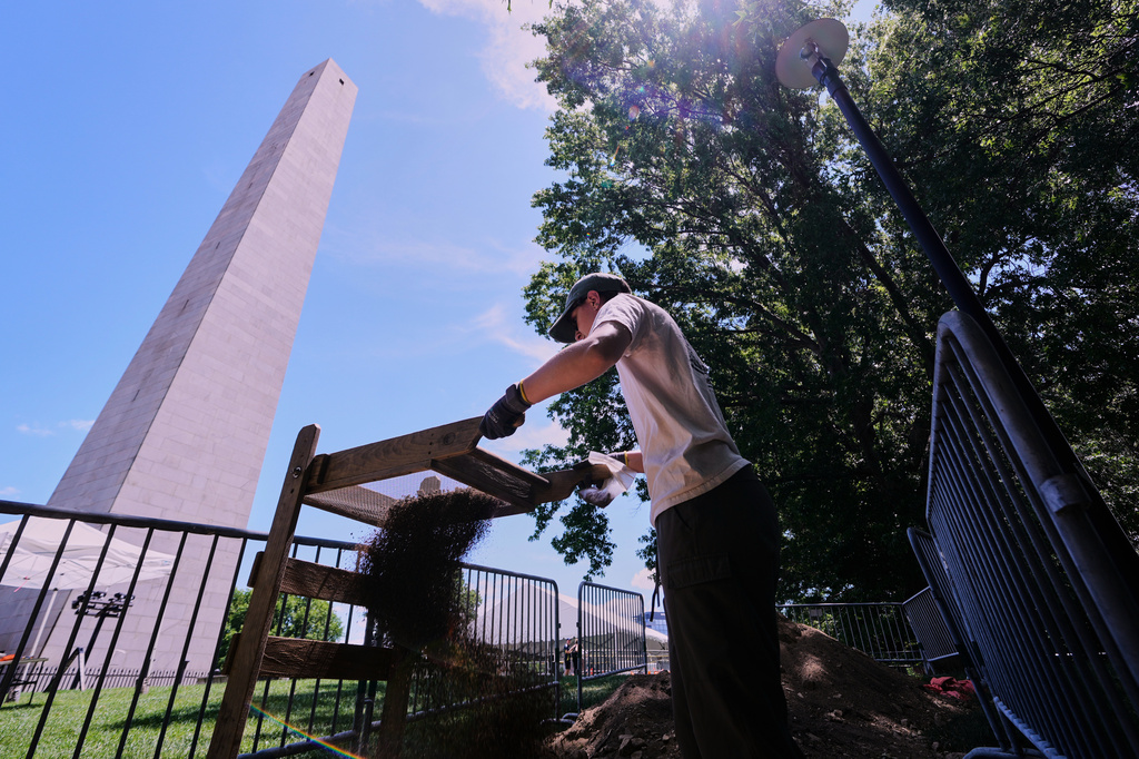 Calla Ruff, an intern from Carleton College, sifts dirt removed from an archaeological dig at the site of the Battle of Bunker Hill