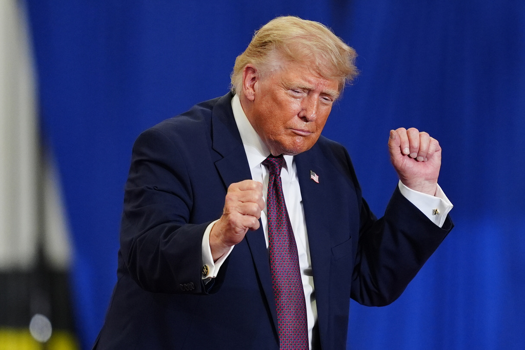 President Donald Trump dances on stage at a Mack Trucks facility in Macungie, Pa. 