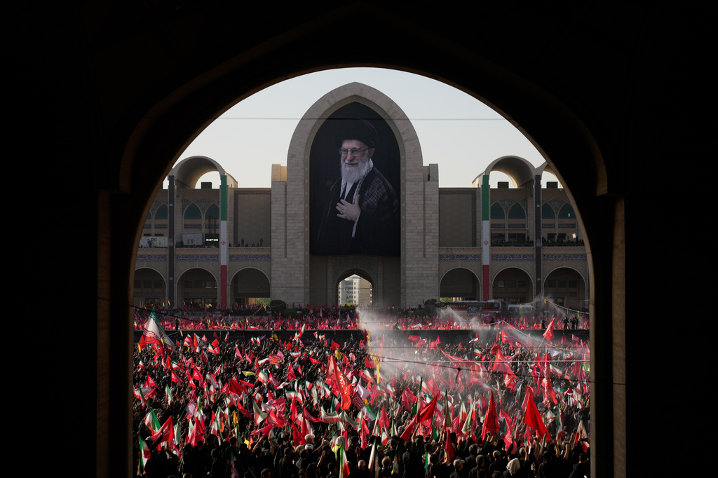 Mourners attend funeral prayers held as part of the dayslong funeral service for the slain Iranian Supreme Leader Ayatollah Ali Khamenei and members of his family