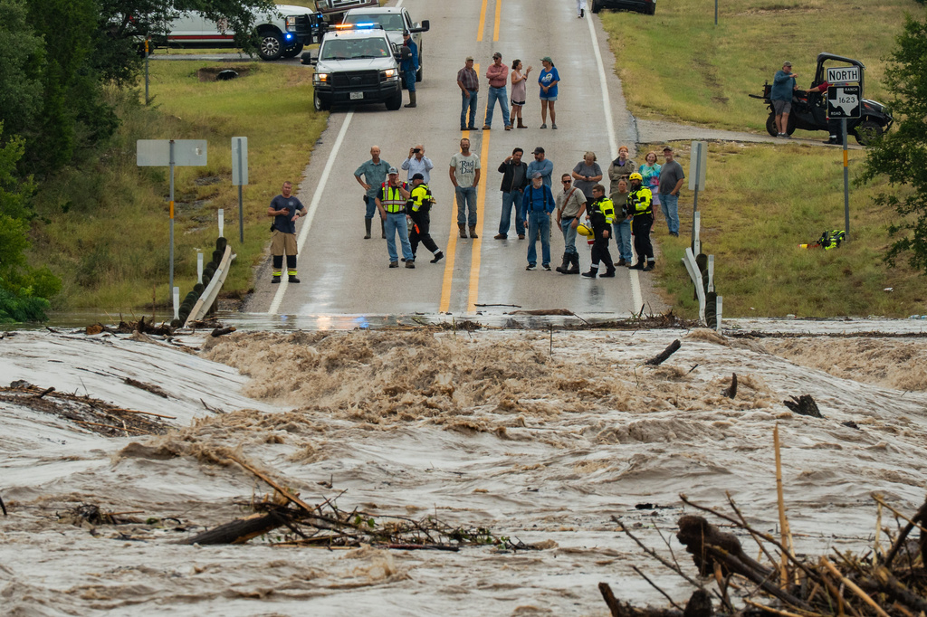 The Perdenales River floods Ranch Road 1623 in Stonewall, Texas