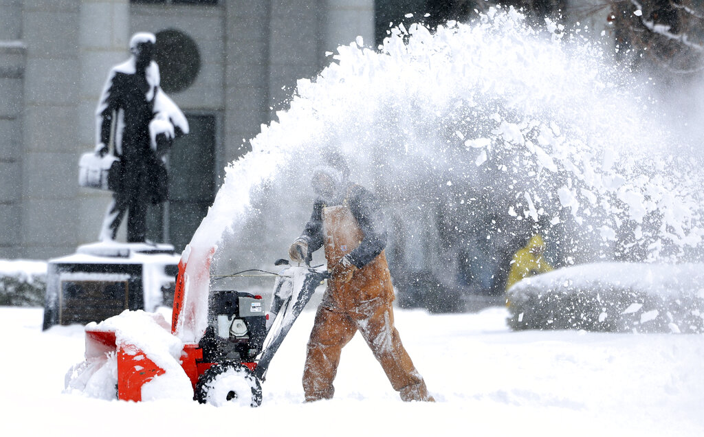 Capitol groundskeeper Mike Nielson clears the walkways at the Capitol in Salt Lake City, Utah